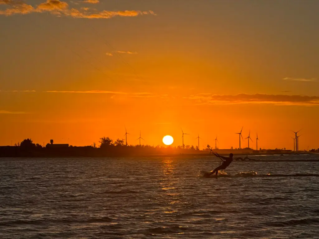 Kitesurfer at sunset in Parajuru