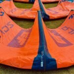 Kitesurf kites laid out on the grass