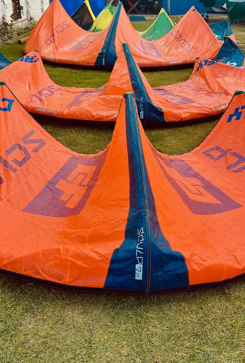 Kitesurf kites laid out on the grass