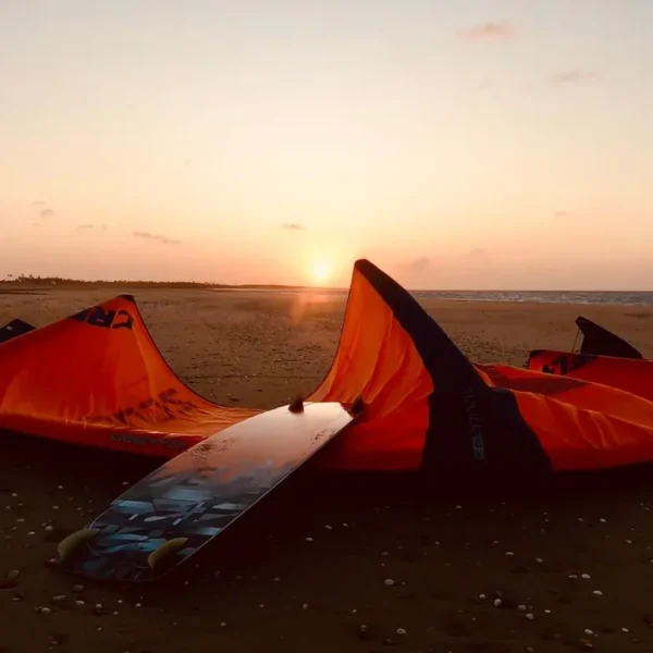 Kites and board on the beach at sunset in Parajuru