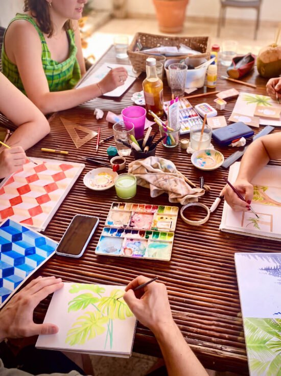 Watercolour painting workshop around a table in Parajuru, Brazil