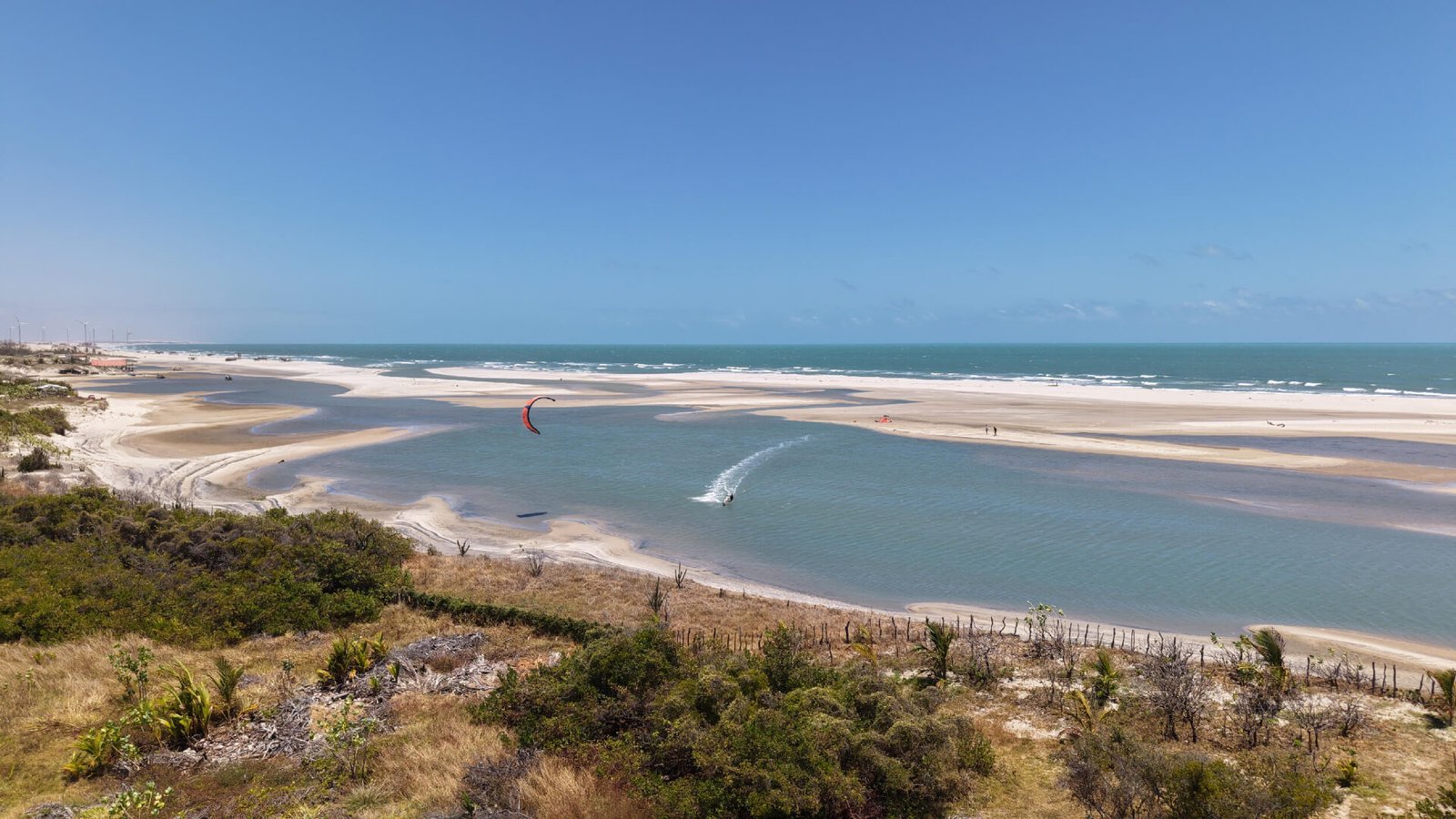Kitesurfer riding the flat-water lagoon in Parajuru, Ceará, Brazil