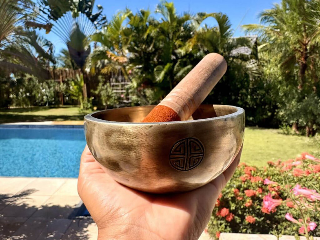 Tibetan singing bowl by the pool at Caju Knots yoga retreat, Parajuru, Brazil