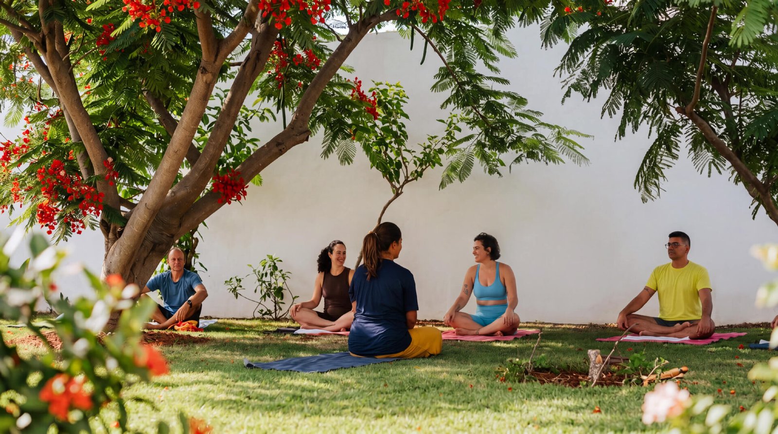 Outdoor yoga class in the tropical garden at Caju Knots, Parajuru, Brazil